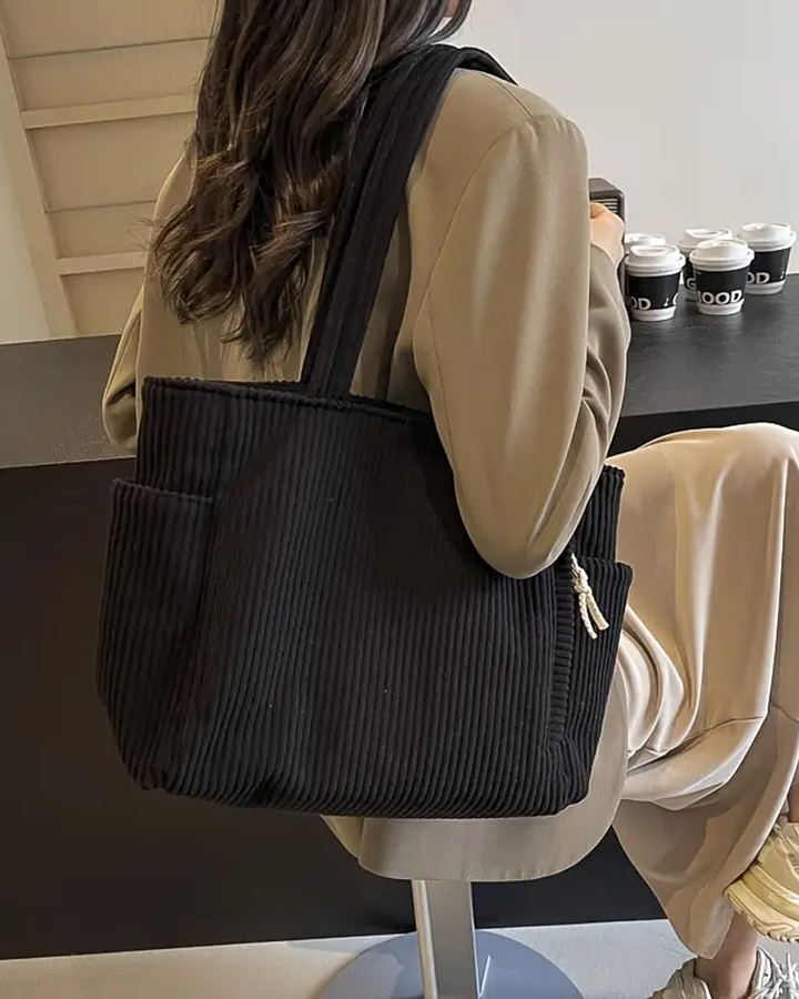 Rosa – Ribbet mulepose med snore-detalje